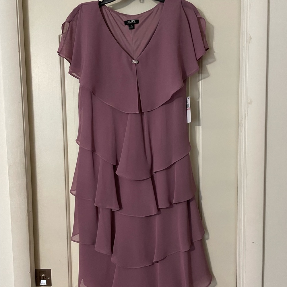 Brand new Below knee cocktail dress.